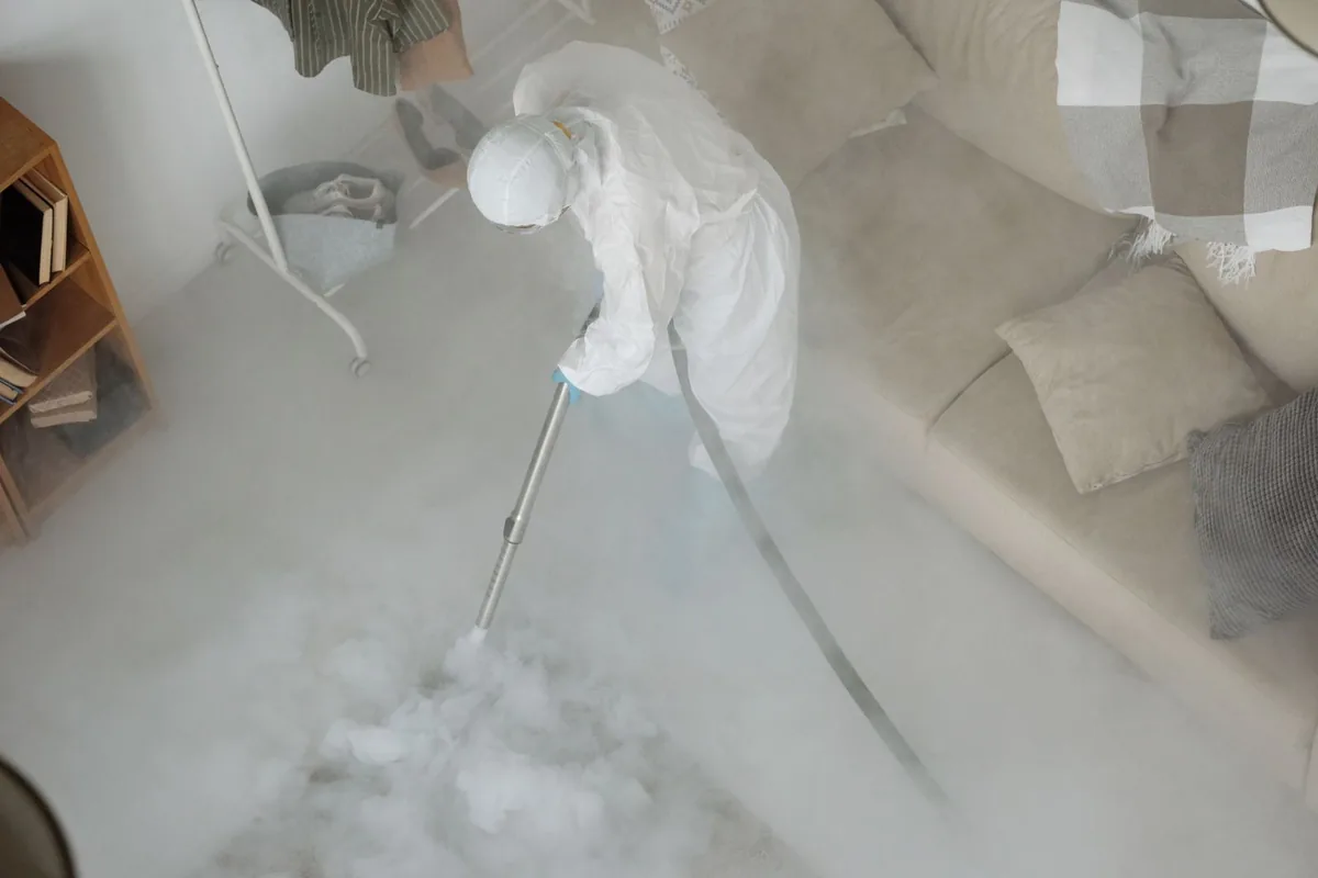 Biohazard cleanup technician in protective equipment, Eagle, CO